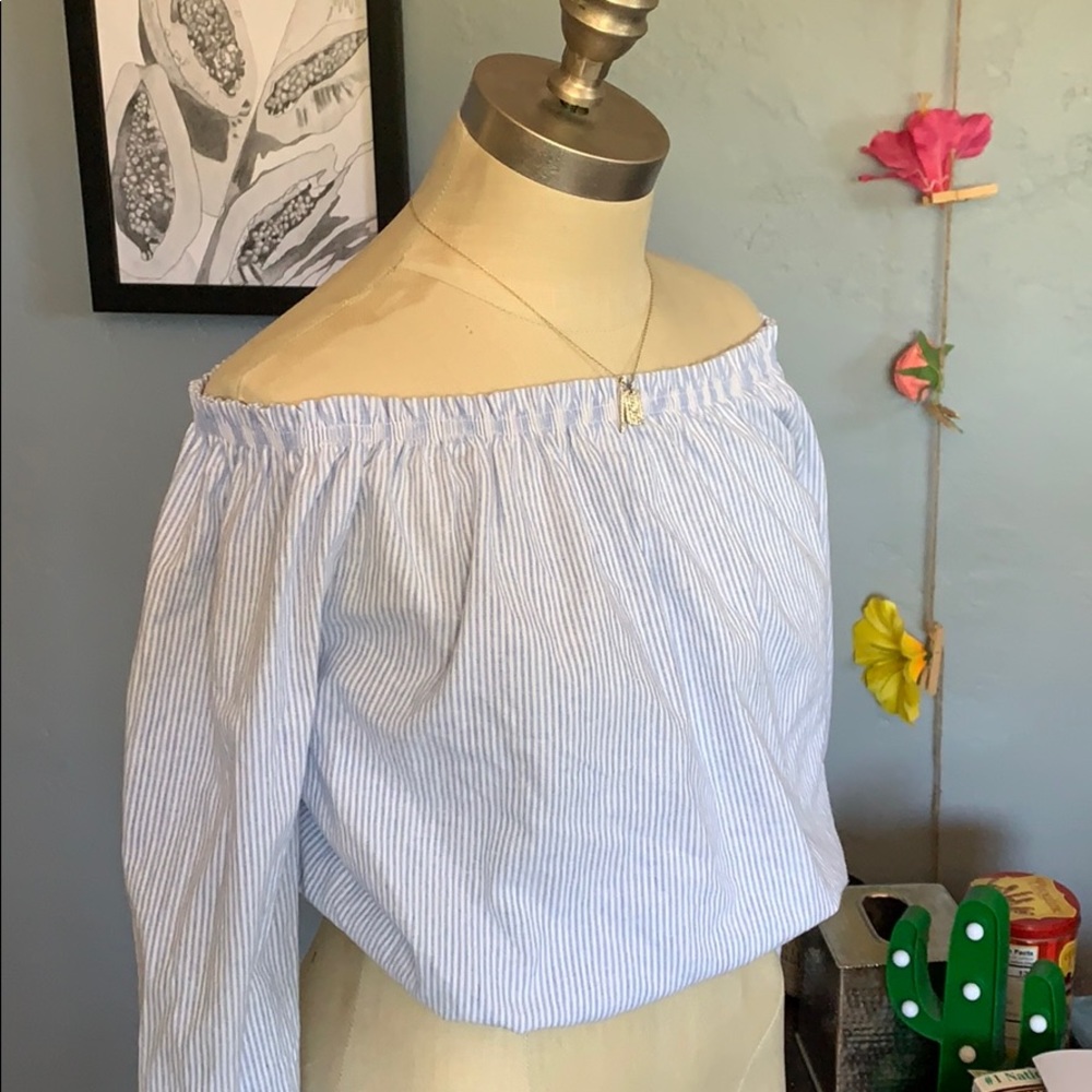 Soft off the shoulder stripped long sleeve. .